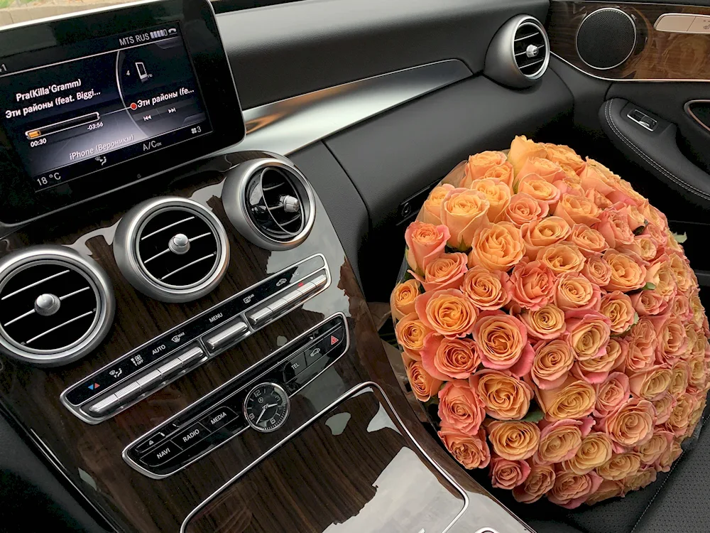 A bouquet of roses in the car