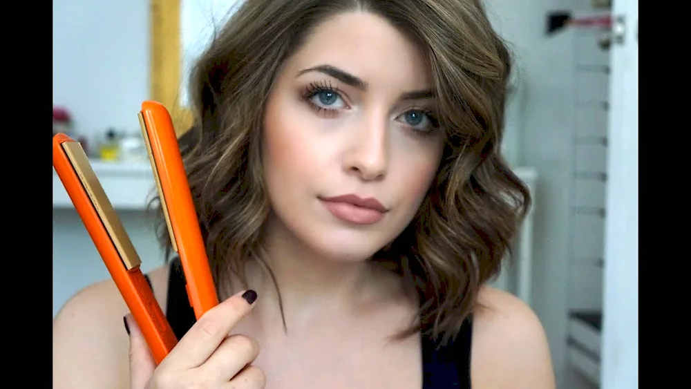 Middle hair curls with a curling iron