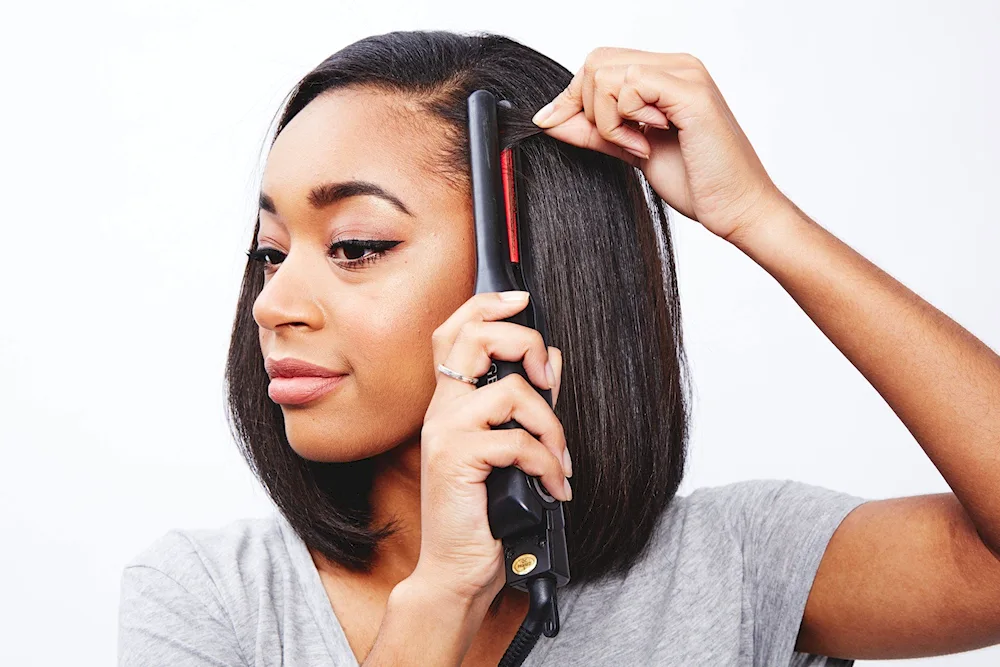 Barre curls on long hair with a curling iron. long hair with a flat iron