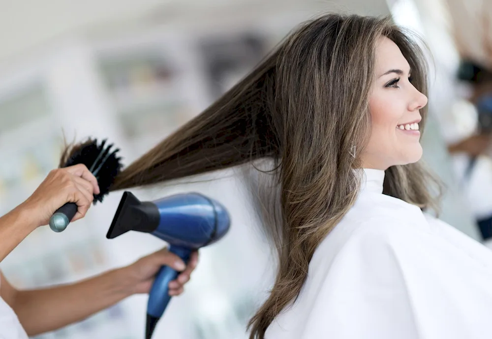 Hairdrying with a blow dryer. Brushing