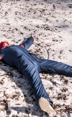 lying in the snow