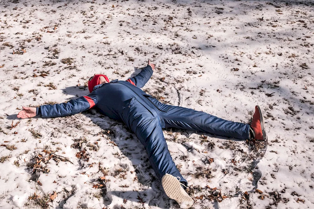 lying in the snow