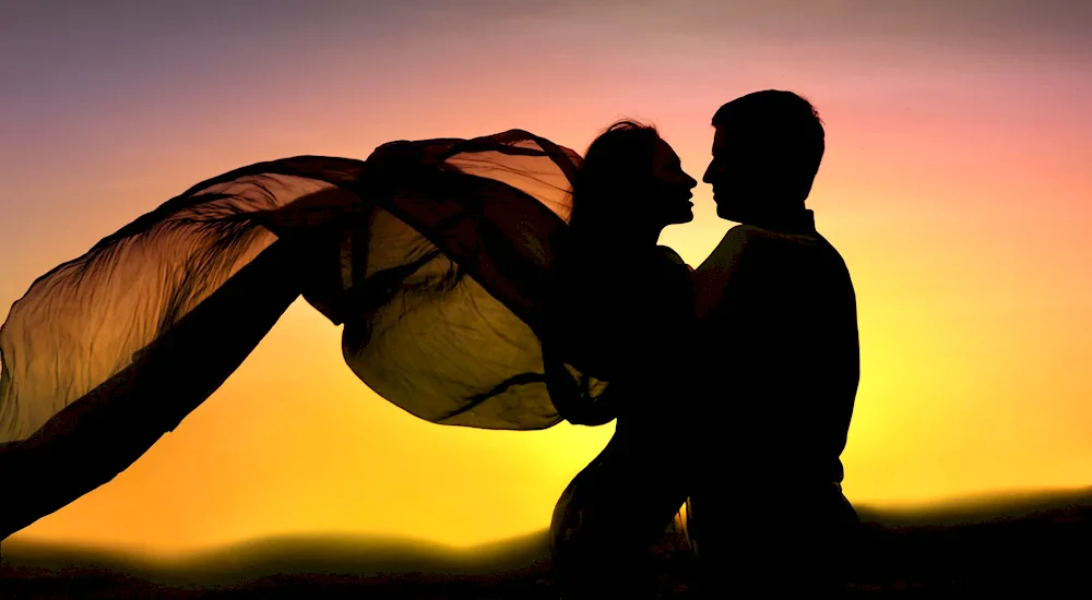 Beautiful couples in love at sunset