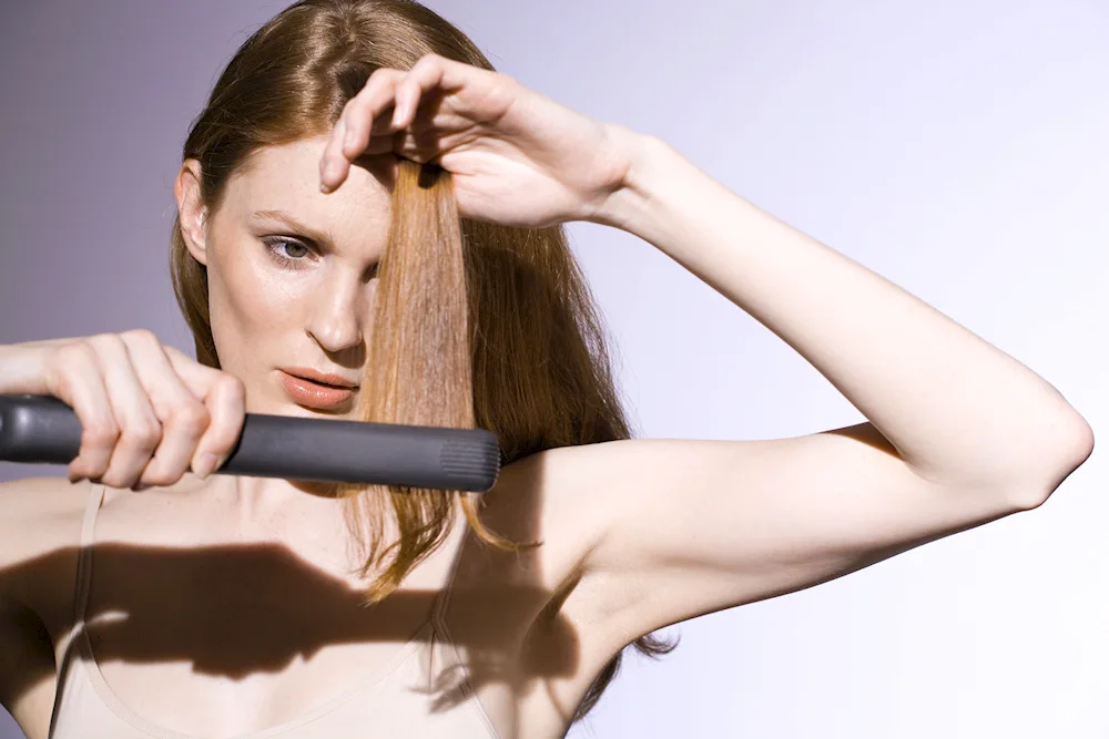 Straighten hair with a flat iron