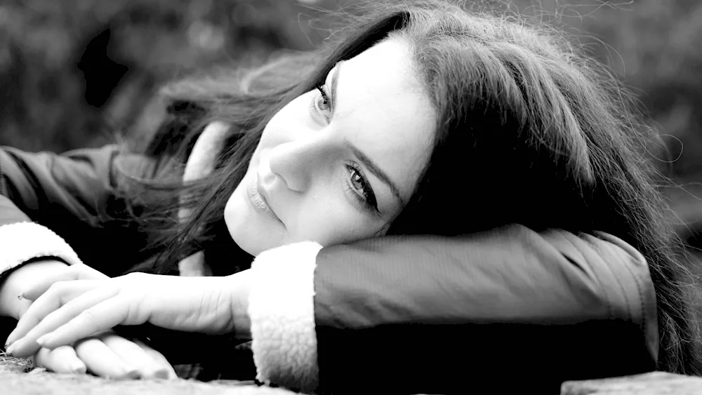 Girl sitting on window sill