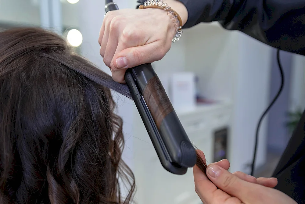 Techniques for curling hair on a flat iron