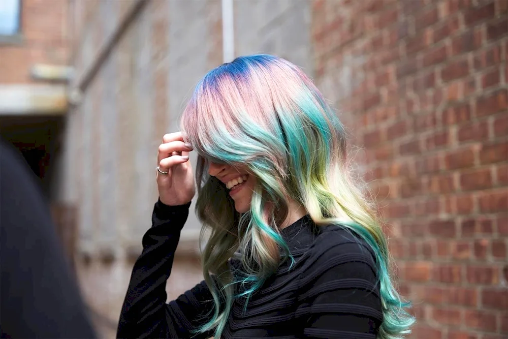 Green strands on blonde hair