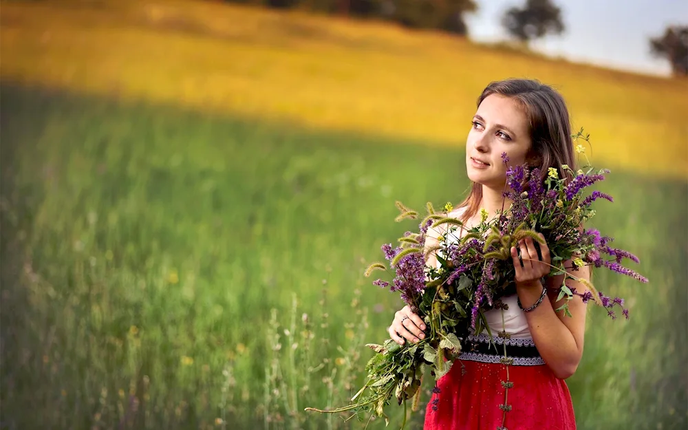 Woman with a bouquet of wildflowers