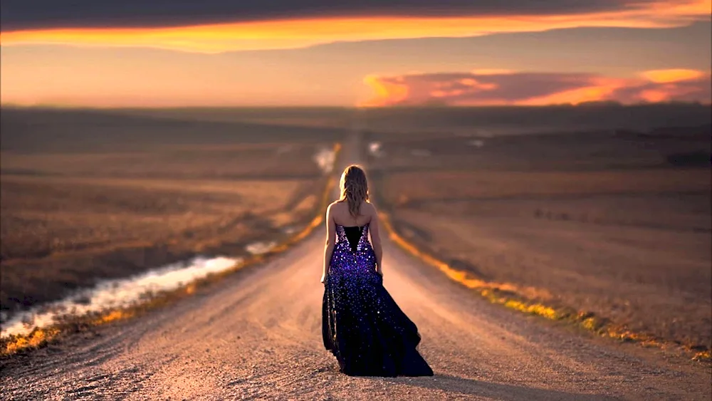 Girl walking into the sunset