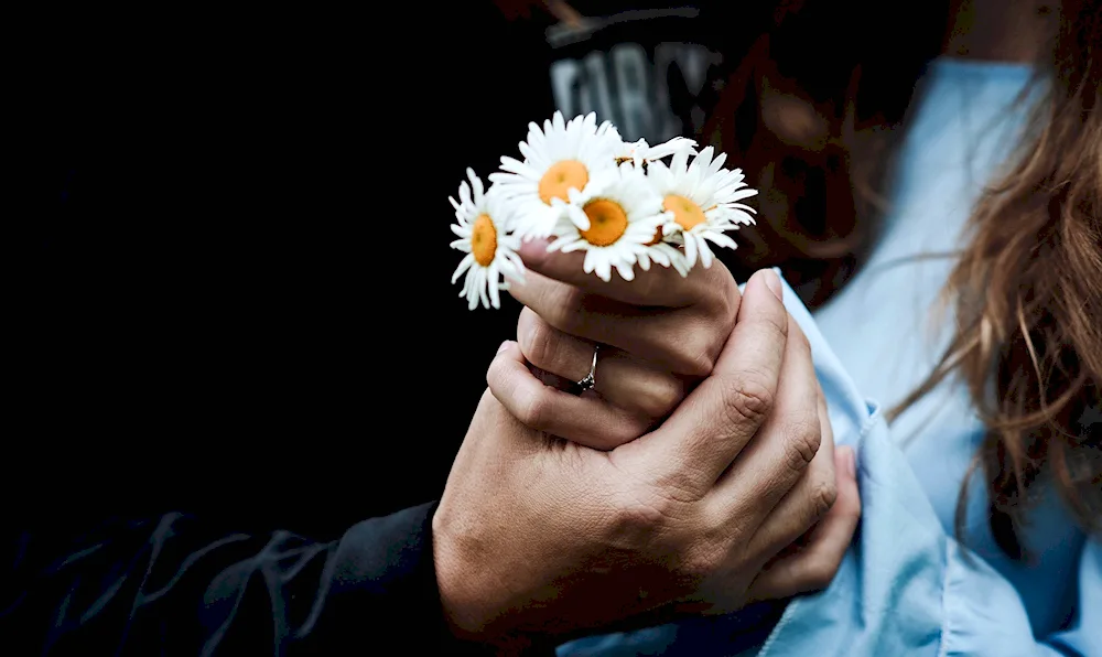 Woman's hand with flowers