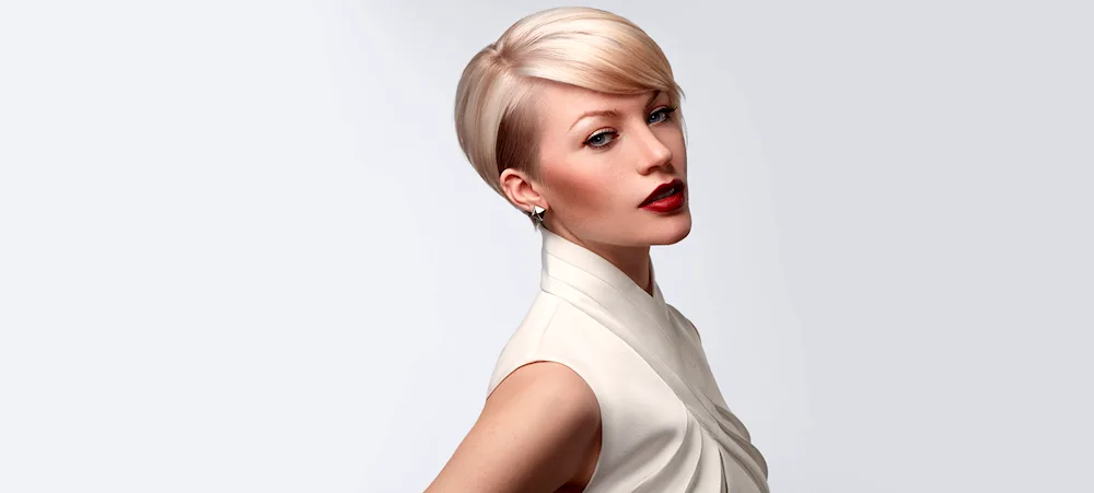 Women's haircut on grey background