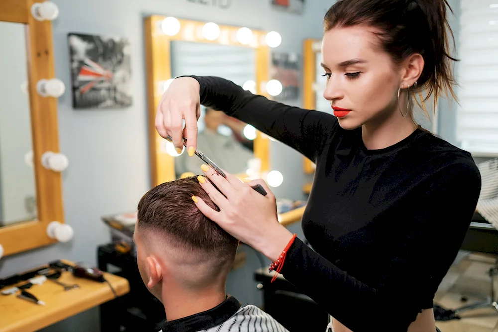 Women's haircut in a barbershop