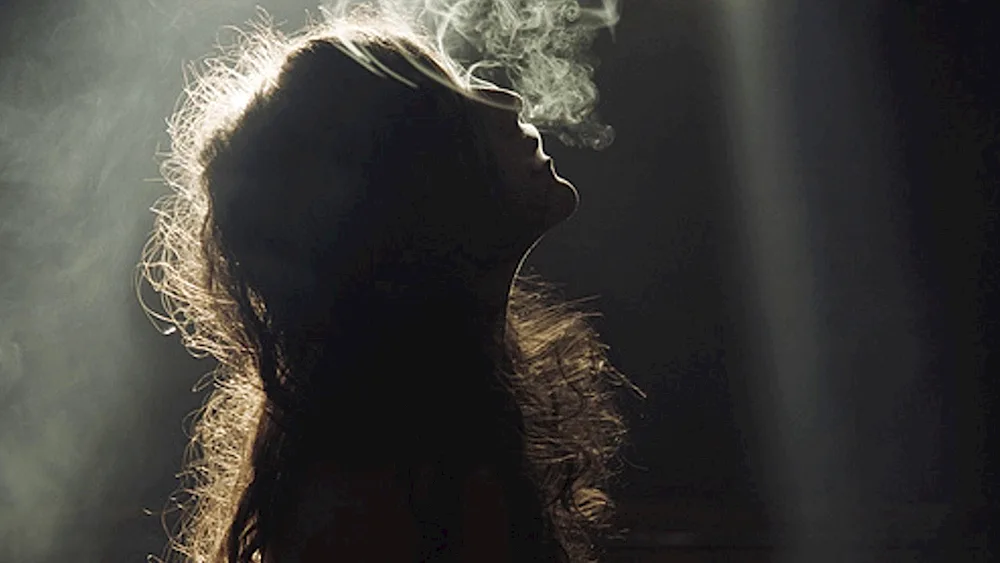 Woman silhouette in the dark