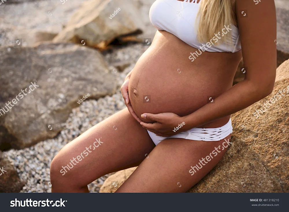 Pregnant women on the beach