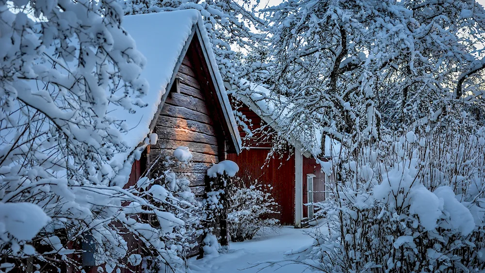 Winter cottage in the village